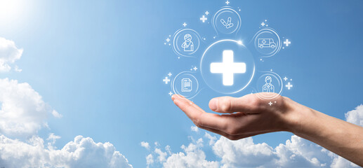 Businessman hold virtual plus medical network connection icons. Covid-19 pandemic develop people awareness and spread attention on their healthcare.Doctor,document,medicine,ambulance,patient icon.