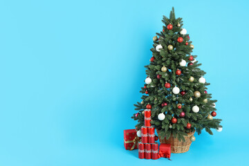 Odessa, Ukraine - November 11, 2021: Composition with Christmas tree and gifts on blue background