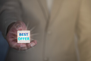 Businessman holding wooden cubes with the word best offer text