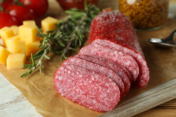Сoncept of tasty food with salami sausage, close up