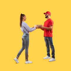 Male Courier Giving Parcel Box To Customer Woman, Yellow Background
