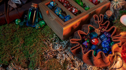 Image of a dice bag, tray with dice, and other role-playing equipment