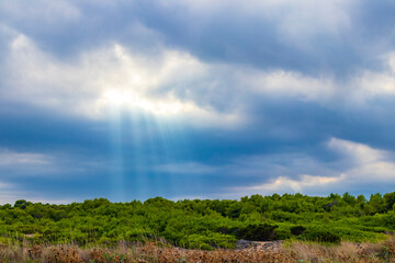 Obraz premium Sunbeams from the sky landscape panorama Can Picafort Mallorca Spain.