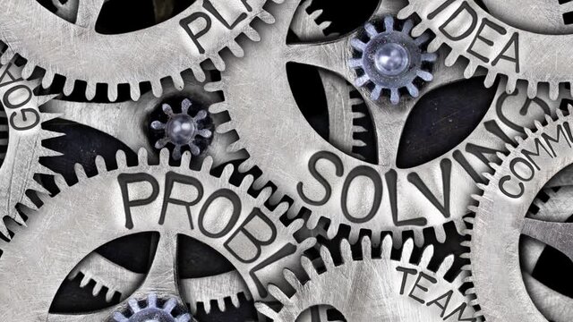 Group of rotating tooth wheels with Problem Solving sign imprinted on metal surface. Concept of Goal, Planning, Teamwork and Communication. High quality 4k video.