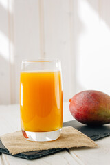 Mango juice in a glass, fresh fruit drink