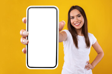 Woman showing white empty smartphone screen close up to camera