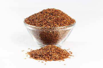 Raw seeds in a glass bowl isolated on white background.