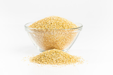 Closeup real quinoa seeds in a glass bowl isolated on white background.