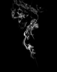 Abstract white smoke on black background. Vertical monochrome, grayscale photography of illuminated...