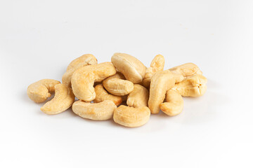 Fototapeta na wymiar Pile of cashew nuts on a white background. Isolated