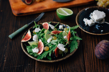 Delicious greek salad with figs and goat cheese