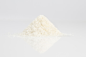 close up of grounded coconut flakes, coconut isolated on white background