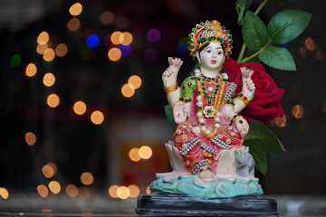 laxmi devi wallpaper with red rose image HD