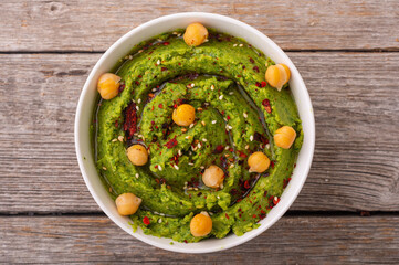 Declicious food from chickpea - green hummus
