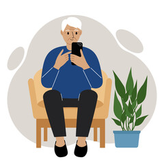 Happy grandfather is sitting in a chair with a mobile phone. Relax and work from home.