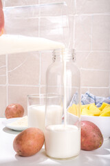 Alternative vegan potato milk, non-dairy creamy drink, with dried, raw and boiled potato 
