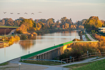 Fototapeta na wymiar The Main-Danube Canal in the warm morning light, Solarberg, Fürth, Bavaria, Germany