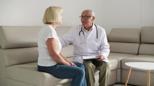 Senior woman have consultation in the clinic by male doctor