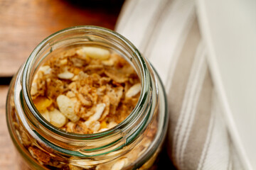 Granola cereal in small glass jar