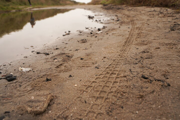 Tire track of a mountain bike in the sand
