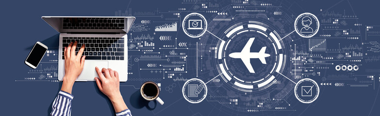 Flight ticket booking concept with person using a laptop computer