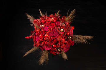 designer red bouquet with roses on black background