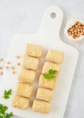 Raw vegetarian gluten free croquettes made with chickpeas. A nutritious vegan starter. Meat alternative Vegetarian Food delivery concept.