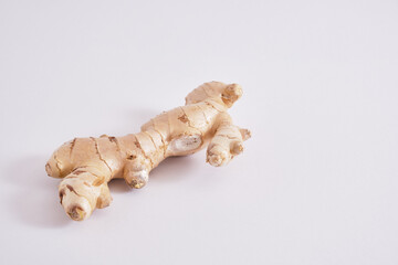 ginger on grey background copy space, ginger root and slices