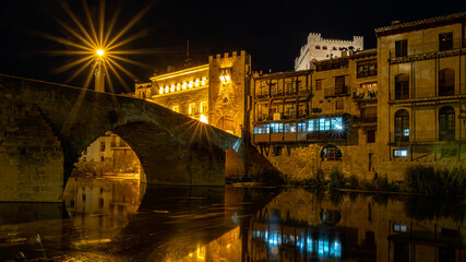 Fototapeta premium Night photography of the medieval bridge of Valderrobres at night, Matarraña, Teruel, Spain