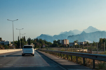 Highway stretching into the distance with mountain views in the shade with aerial perspective in turkey antalya