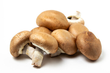 Brown champignons on a white background. Champignon variety. Healthy vegetarian food.