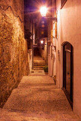 Fototapeta premium Cozy streets of Tossa De Mar, Catalonia, Spain. Picturesque little town near Barcelona. Famous tourist destination Costa Brava.
