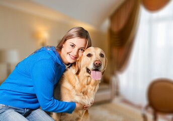 Fluffy dog with its owner young woman, happy playing while staying home,