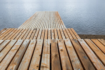 empty wooden pier on the pond. stepped pier on the water