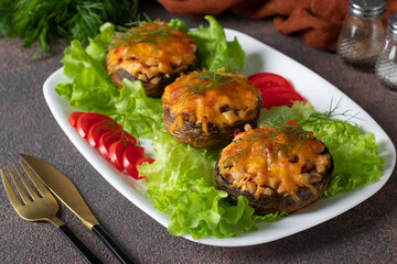 Baked champignons with turkey and cheese, hot festive appetizer, close-up