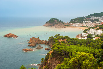 Tossa De Mar, Catalonia, Spain. A picturesque town with a fortress, with beautiful beaches and clean turquoise water in cozy bays near Barcelona. Famous tourist destination Costa Brava.