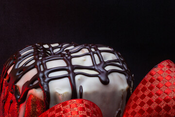 panettone with a red tie with a black background