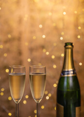 Champagne glasses over holiday bokeh blinking background, glasses with sparkling wine, celebration, party