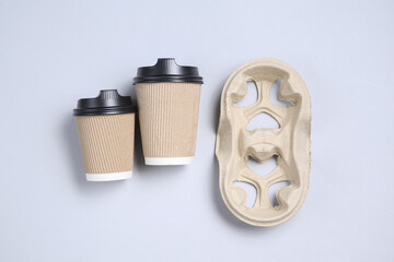 Mock up cardboard cups on a gray background. Top view