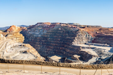 Panorama of Corta Atalaya with mining levels at open mine pit. Deep excavation of pyrite and...