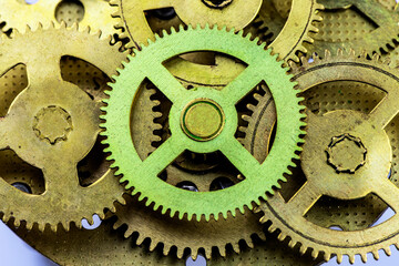 Old bronze gears as background.