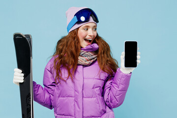 Skier shocked woman in warm purple padded windbreaker jacket goggles mask spend weekend in...