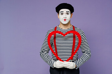 Charismatic amazing surprised puzzled fun romantic young mime man with white face mask wears...