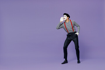 Fototapeta na wymiar Full size promoter young mime man with white face mask wear striped shirt beret scream news about sales discount with hands near mouth isolated on plain pastel light violet background studio portrait