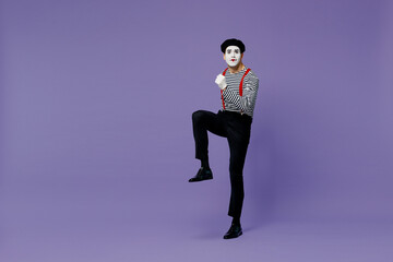 Full size body length charismatic young mime man with white face mask wears striped shirt beret...