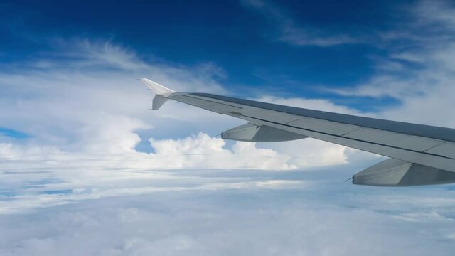 Airplane wing and beautiful clouds