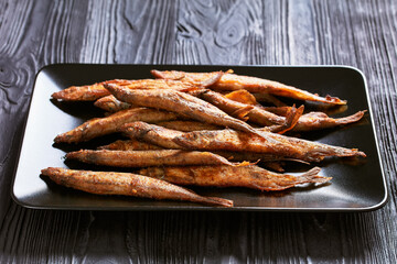 crispy fried capelin, shishamo on a platter