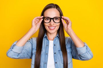 Photo of charming lady put spectacles clever professional marketer isolated over yellow color background