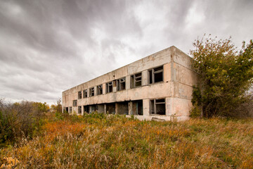 Fototapeta na wymiar Abandoned building of the former village school.