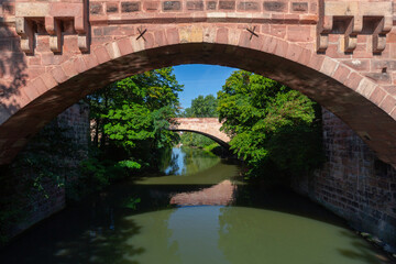 Fototapeta premium Old stone bridge in Nuremberg, Franconia, Germany.